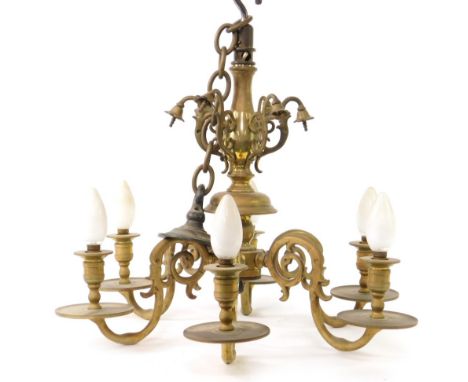 A heavy brass six branch electrolier pendant light fitting, with baluster stem and scroll branches with small sconces and bay