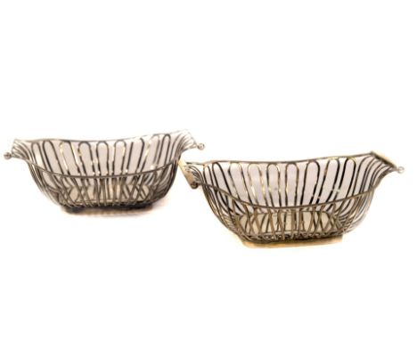 A pair of Edwardian silver oblong bonboniere baskets, with reeded frames and wire work bodies, with plain bases, one inscribe