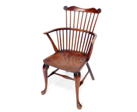 An early 19thC Thames Valley ash, elm and fruitwood low back Windsor chair with comb top cresting rail, spindle back, saddle 