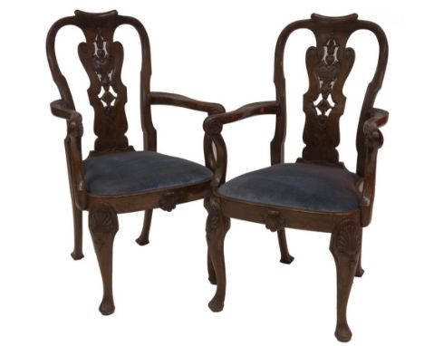 A set of ten late 19thC walnut dining chairs in George I style by Waring &amp; Gillow of Lancaster, including two carvers, ha