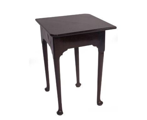 A George III mahogany corner gate leg table, with rounded square drop leaf top, which folds to reveal a open compartment, on 