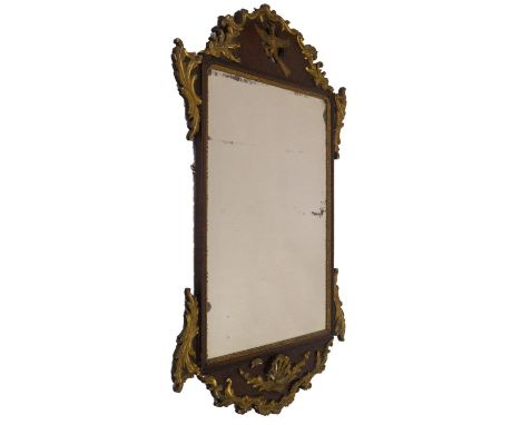 A 19thC parcel gilt pier glass in the Chippendale manner, having parcel foliate scroll and shell applied frame, with ho-ho bi