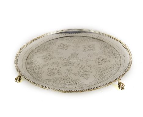 A Victorian circular presentation silver salver, the raised border with beaded decoration and with profusely engraved centre 