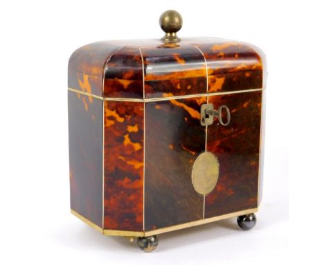 A George III octagonal tortoiseshell tea caddy, with ivory line inlay, the domed lid with silver ball knop opening to reveal 