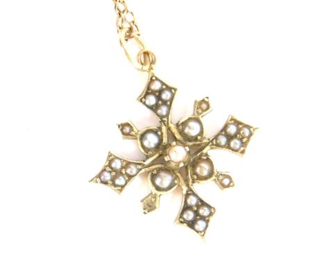 A Victorian seed pearl set cross pendant, the cross pendant yellow metal, marked to rear 9ct, on a fine link gold plated chai
