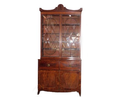 A George III mahogany secretaire bookcase, with a stepped arch pediment with satinwood stringing, flame frieze over two tall 