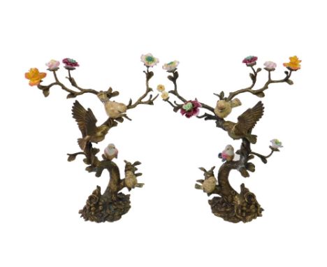 A pair of cast metal garniture of birds on floral boughs with ceramic petals, unsigned, 41cm (2).