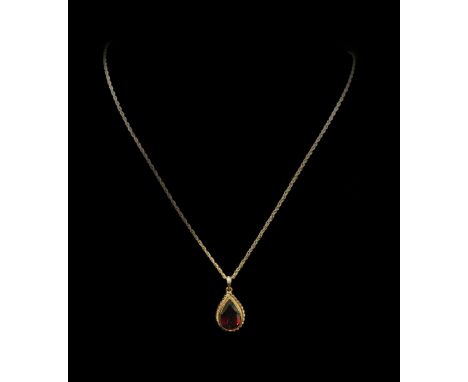 A 9ct gold garnet pendant, with tear drop shaped garnet, in a 9ct gold frame, with rope twist border, on fine link chain, 5g 