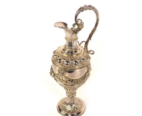 A Victorian Scottish silver claret jug, of classical ewer shaped designed with a hinged lid to the spout, with lappet and scr