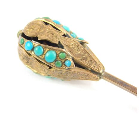 A Victorian turquoise set stick pin, with ball top design, with partial scroll engraving and set with turquoise stones, yello