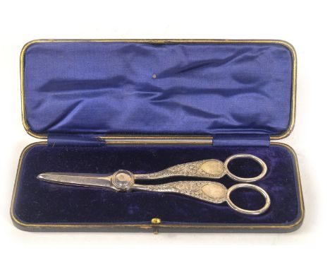 A pair of late Victorian silver grape scissors, with engraved scroll handles, Sheffield 1894, makers Allen &amp; Darwin, 3.33