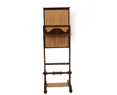 An early Victorian rosewood screen, with pleated satin panel, on a rise and fall mechanism, single fret work shelf, over a ri