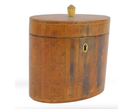 A George III burr yew oval tea caddy, the lid with carved ivory urn finial, inlaid with a sunburst extending to the sides, iv