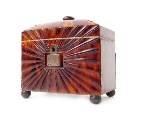A small Regency tortoiseshell tea caddy, of bowed rectangular design, with quartered hinged lid and radial fluted front, the 