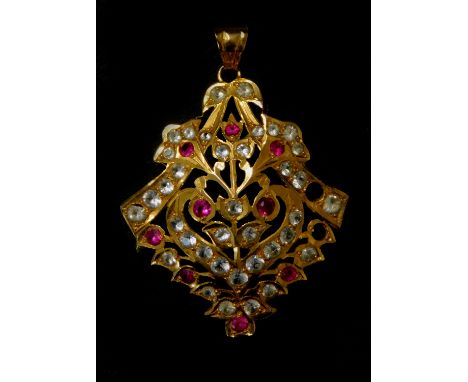An Asian design lozenge shaped pendant, set with pink and white stones, probably ruby and imitation diamond, with stamping to