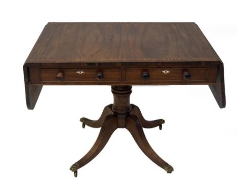 A Regency mahogany sofa table, with satinwood banding and rosewood cross banding to the top, having two frieze drawers and op