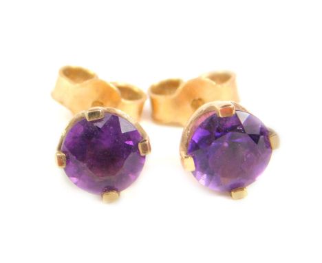 A pair of amethyst stud earrings, each stone round brilliant cut, in claw setting, with enclosed back, with butterfly backs, 