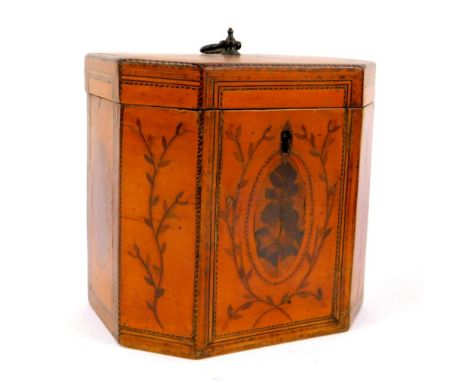 A Sheraton period satinwood octagonal tea caddy, the lid with brass loop handle, inlaid with oval panels of specimen woods an