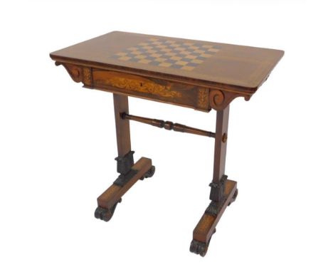 A Regency rosewood and marquetry games table in the manner of T &amp; G Seddon, with rectangular chequerboard top having an i