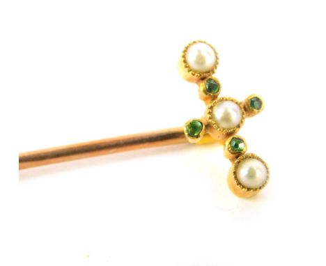 A Victorian stick pin, with design of seed pearls and peridot in a cross type shape, yellow metal, marked to top 15ct, 6cm hi