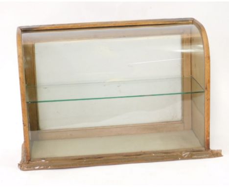 A Victorian shop counter display case, with bowed glass front, fitted a glass shelf and with hinged fall back, 49cm H, 34cm W