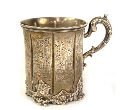 An early Victorian silver mug, with slightly everted moulded lip, and broad fluted panels of engraved decoration, with an aca