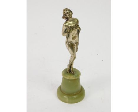 An Art Deco onyx and nickel plated figure of a lady, by R. Lor,&nbsp; wearing a chemise and holding her chest, signature to u