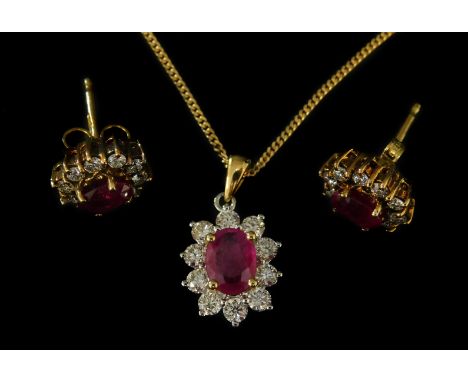 An 18ct gold ruby and diamond pendant and earring set, formed in a floral cluster, with central ruby, surrounded by ten diamo