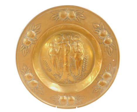 A 18thC Flemish brass Tree of Life dish, embossed centrally with the serpent entwined tree flanked by Adam &amp; Eve, within 