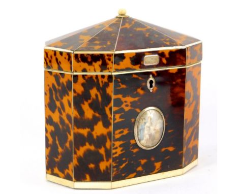 A George III tent top octagonal tortoiseshell tea caddy, with an ivory knop, ivory and silver line inlay, opening to reveal t