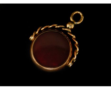 A Victorian 9ct swivel fob, set wtih circular green and red agate, in 9ct gold border, marked with makers stamped H.A &amp; S