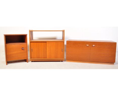 A pair of retro vintage mid 20th Century teak record cabinets. The cabinet of rectangular form with top storage section, twin