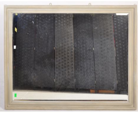 A large vintage 20th century wall mirror of rectangular form having stepped side painted in a pale blue colourway. Measures 1