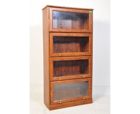 A retro vintage mid 20th Century Globe Wernicke style oak lawyers/library bookcase. Having a glazed drop down door, with 3 op