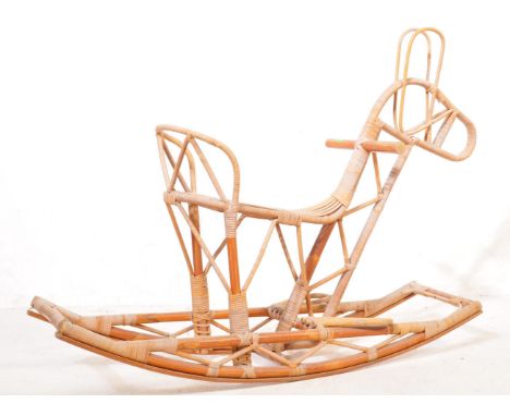 A mid 20th Century retro vintage circa 1970's children's bamboo/wicker rocking horse. The rocking horse having a seat, handle