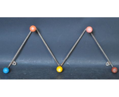A vintage retro mid 20th century Atomic Sputnik style coat rack having a metal frame with coloured wooden hooks. Measures 49c
