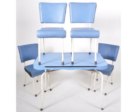 A retro vintage 1950's dining suite comprising a blue melamine coated dining table with ebonised flash sides raised on white 