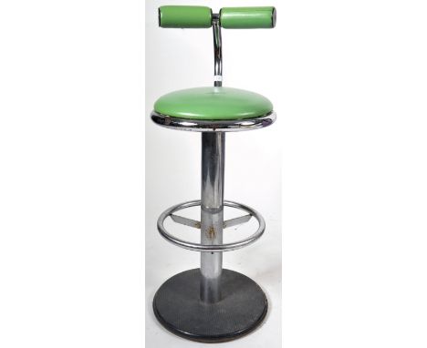 A retro vintage mid 20th Century adjustable bar stool chair comprising a green cushioned cylindrical back with circular seat,
