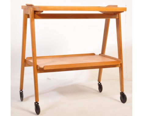 A Remploy mid 20th Century vintage golden oak two tier drinks/waiter trolley having a detachable tray tier to top, all raised