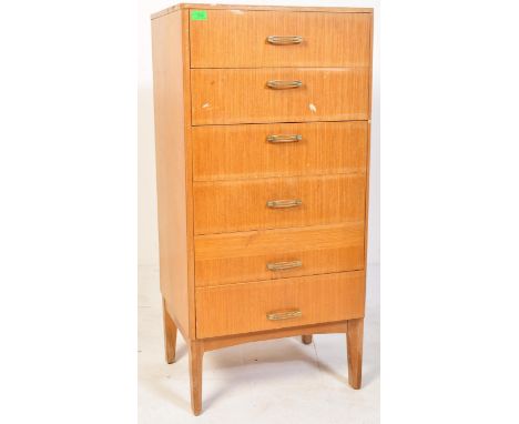 A vintage retro mid 20th century Remploy teak chest of drawers having a bank of six drawers with angular handles, raised upon