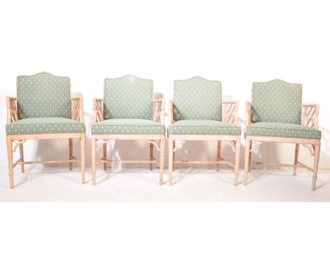 A set of 4 retro vintage 20th Century faux bamboo conservatory lounge chairs. The chairs having and arched cushioned backrest