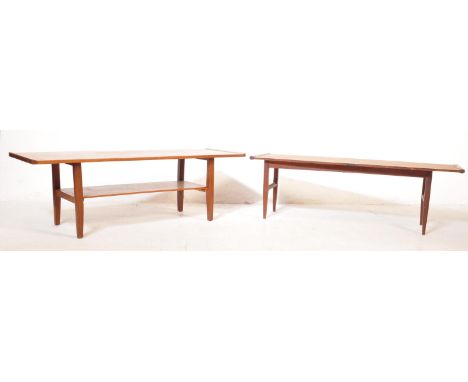 A pair of retro vintage mid 20th Century circa 1960's teak coffee tables. The table of rectangular form with a bottom tier ma