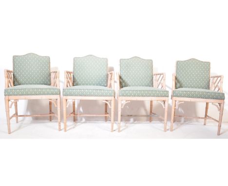 A set of four retro vintage 20th Century faux bamboo conservatory/lounge chairs. The chairs having and arched cushioned backr