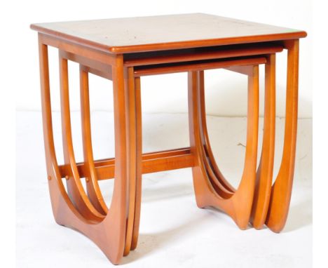 A retro vintage mid 20th Century teak nest of tables. The tables being in the manner of the quadrille range of G Plan - havin