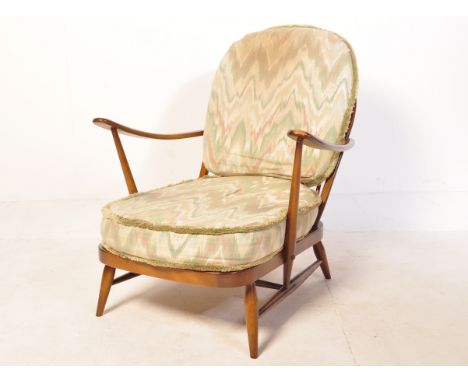 Lucian Ercolani - Ercol - Model 203 - A 1970's vintage retro beech and elm easy / lounge chair / armchair having large hoop s