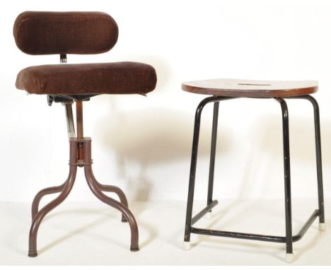 A vintage 20th century office chair with padded back rest and seat united by a brown tubular metal frame and being upholstere