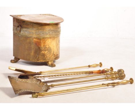 A companion set of vintage 20th century brass fireside items comprising of a coal bin together with a poker shovel and more. 