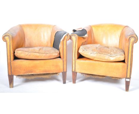 A pair of retro vintage 20th Century Dutch club chairs / tub fireside armchairs having tan brown sheepskin leather upholstery