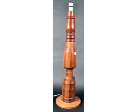A retro vintage mid 20th Century teak and mahogany standard lamp / half size lamp having a thick turned column with all raise