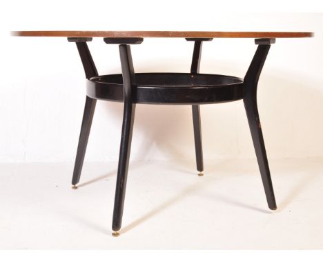 G-Plan - E. Gomme - A retro vintage mid 20th century teak wood G Plan dining table of circular form over four black ebonised 